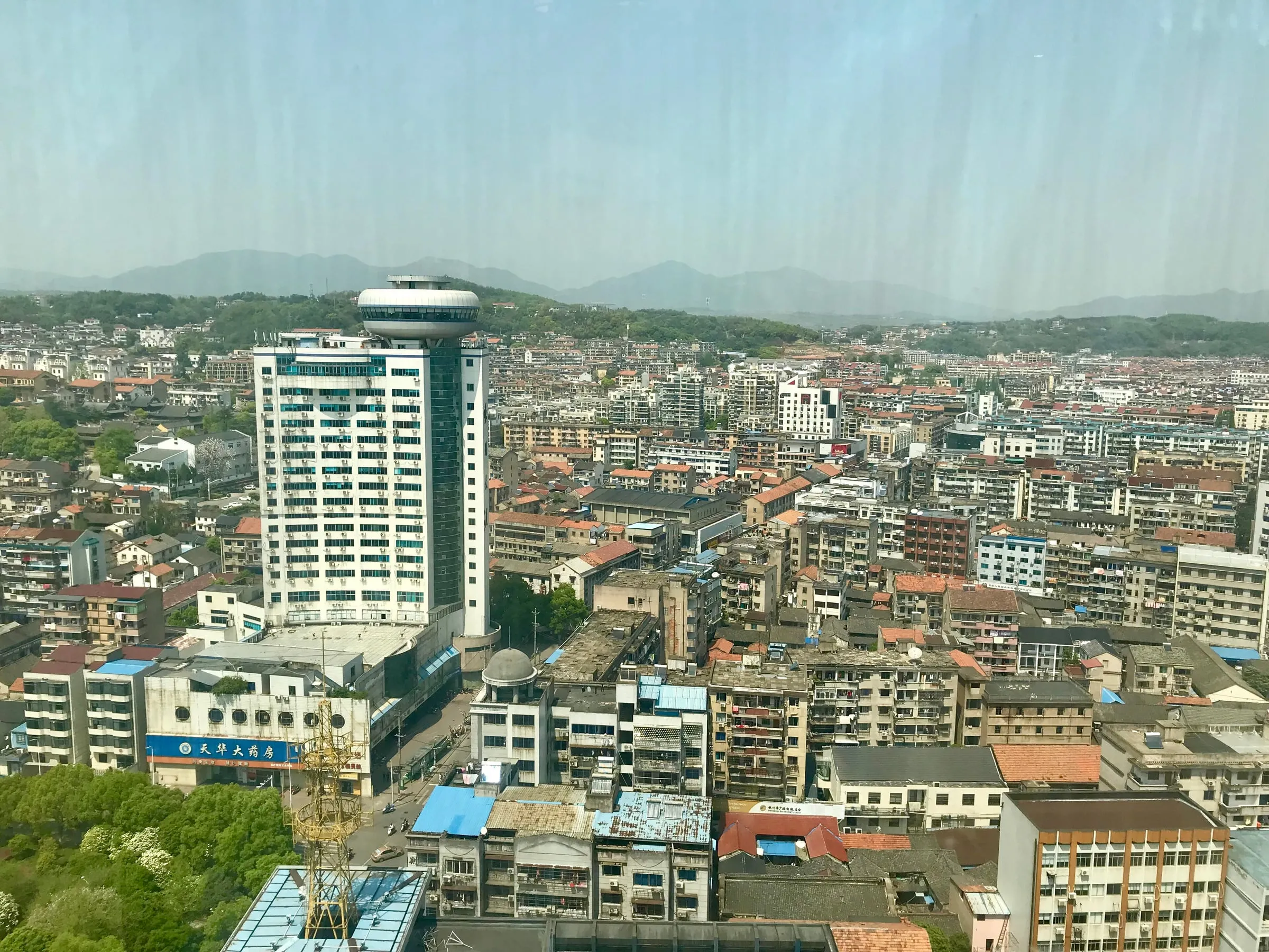 Shengzhou today, ringed by hills.