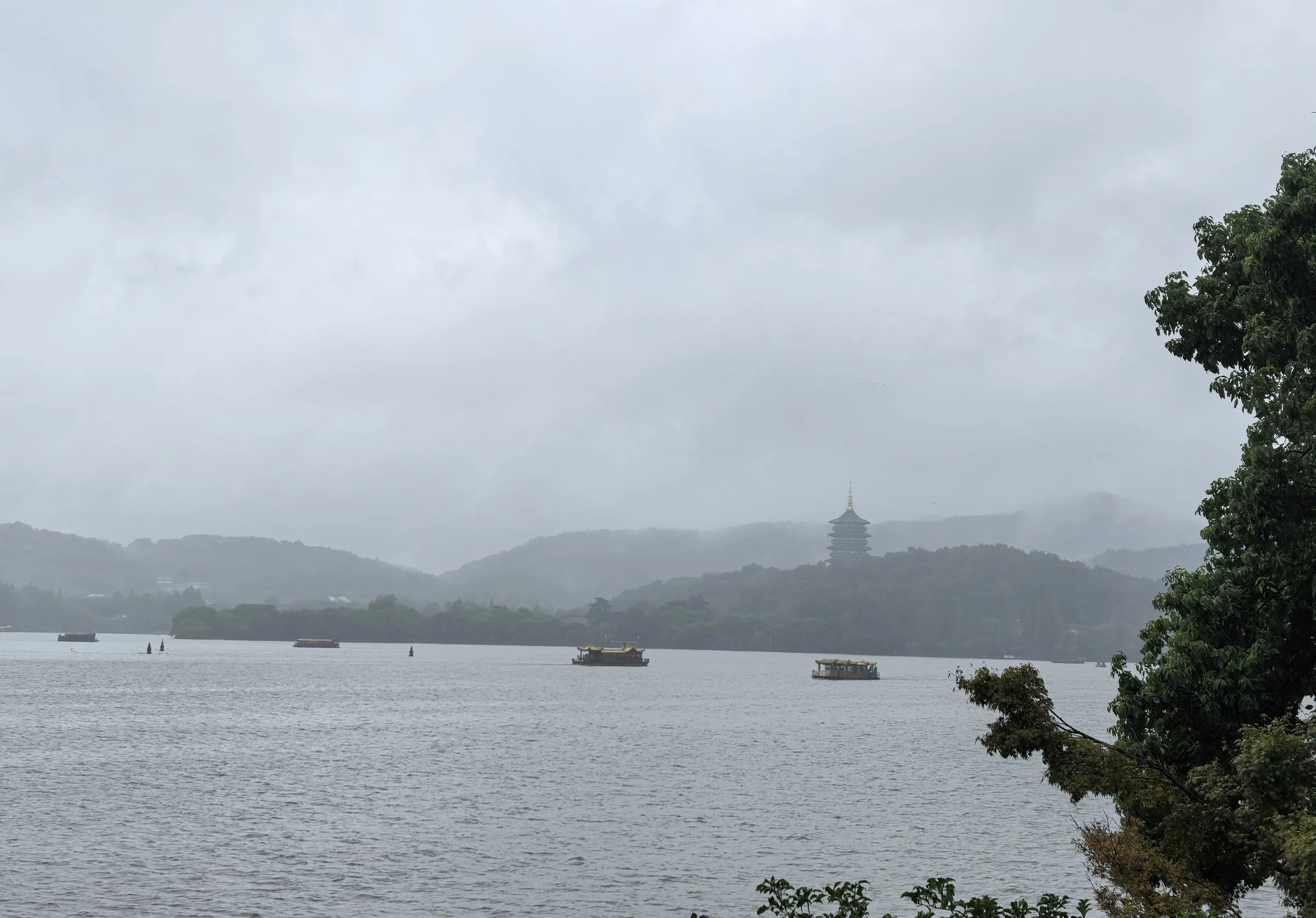 West Lake in the rain, with Leifeng Pagoda in the distance.